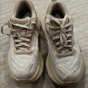 Hoka Cream and Tan Athletic Shoes with Breathable Mesh.

Sold as is.